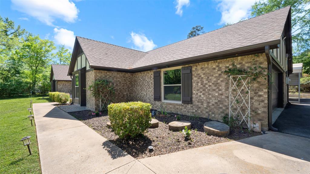 2801 Florence Street Kilgore, TX 75662 - Photo 6 of 39 a front view of a house with garden