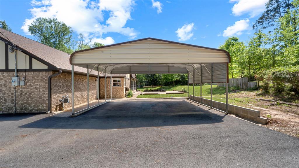 2801 Florence Street Kilgore, TX 75662 - Photo 8 of 39 a view of a house with backyard and porch