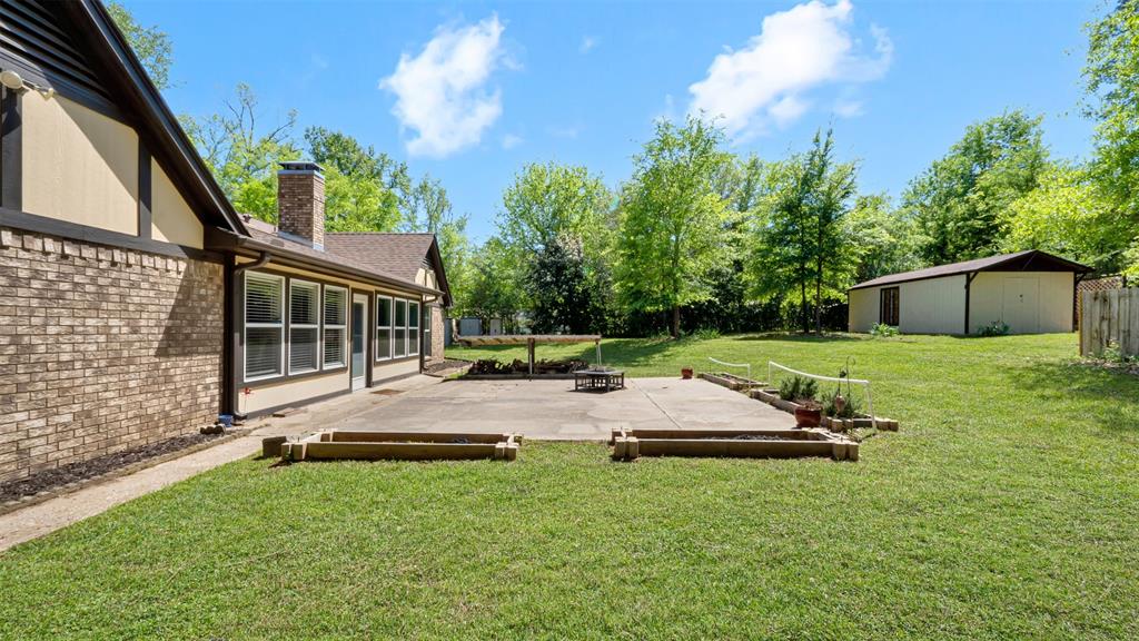 2801 Florence Street Kilgore, TX 75662 - Photo 9 of 39 a view of a house with backyard and sitting area