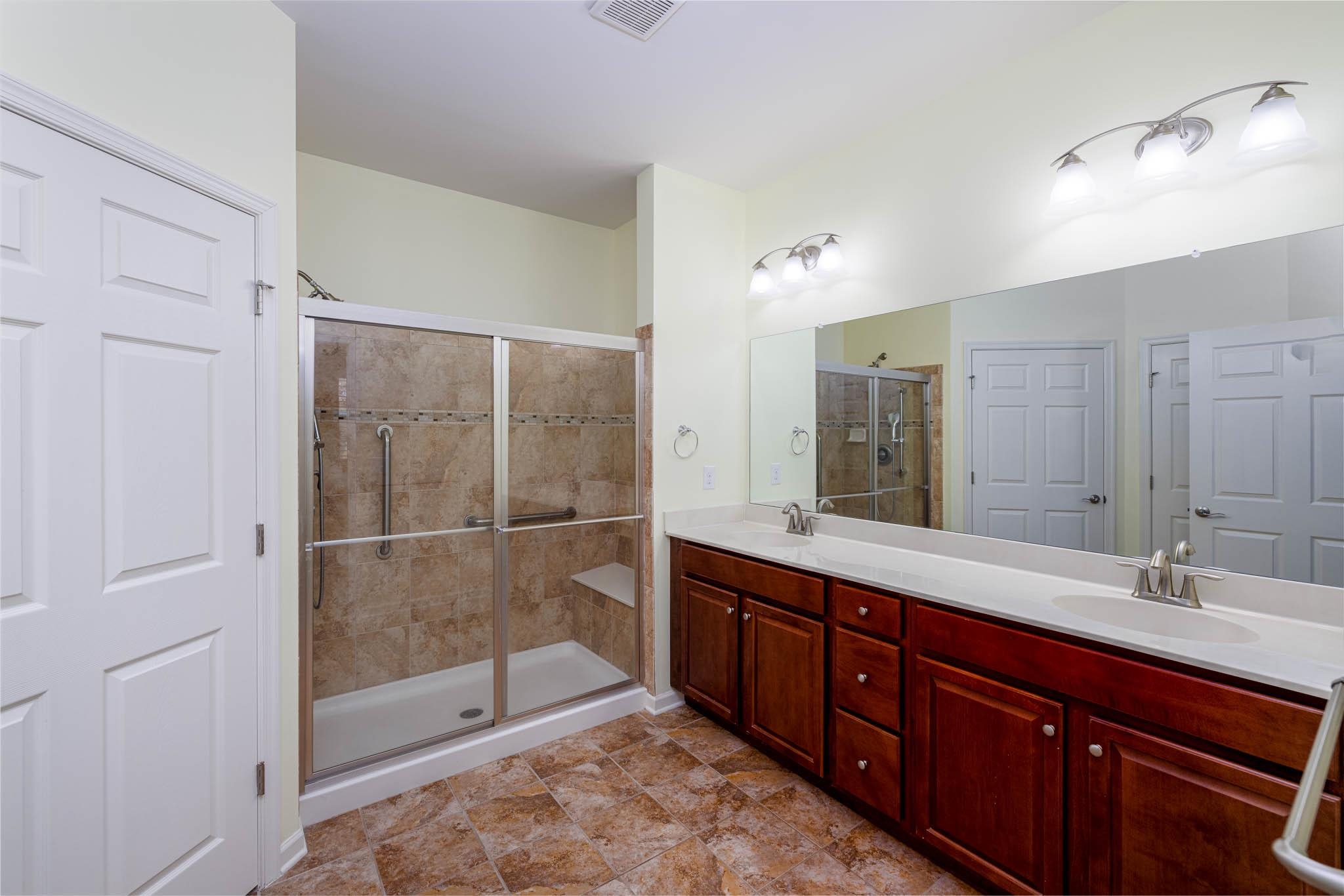 302 Aberdeen Way Rio Grande, NJ 08242 - Photo 13 of 23 a spacious bathroom with a double vanity sink mirror and double