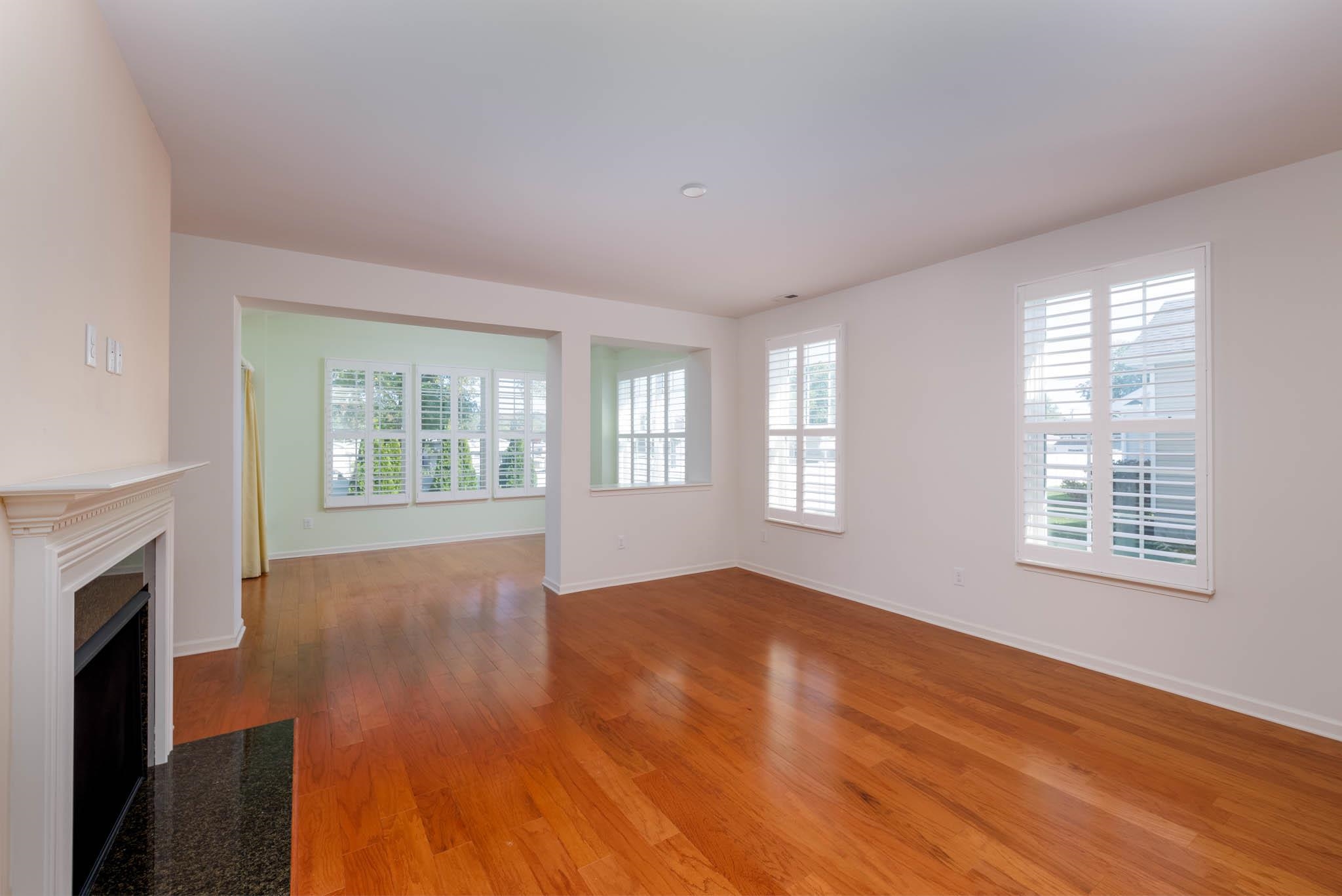 302 Aberdeen Way Rio Grande, NJ 08242 - Photo 8 of 23 a view of an empty room with wooden floor and a window