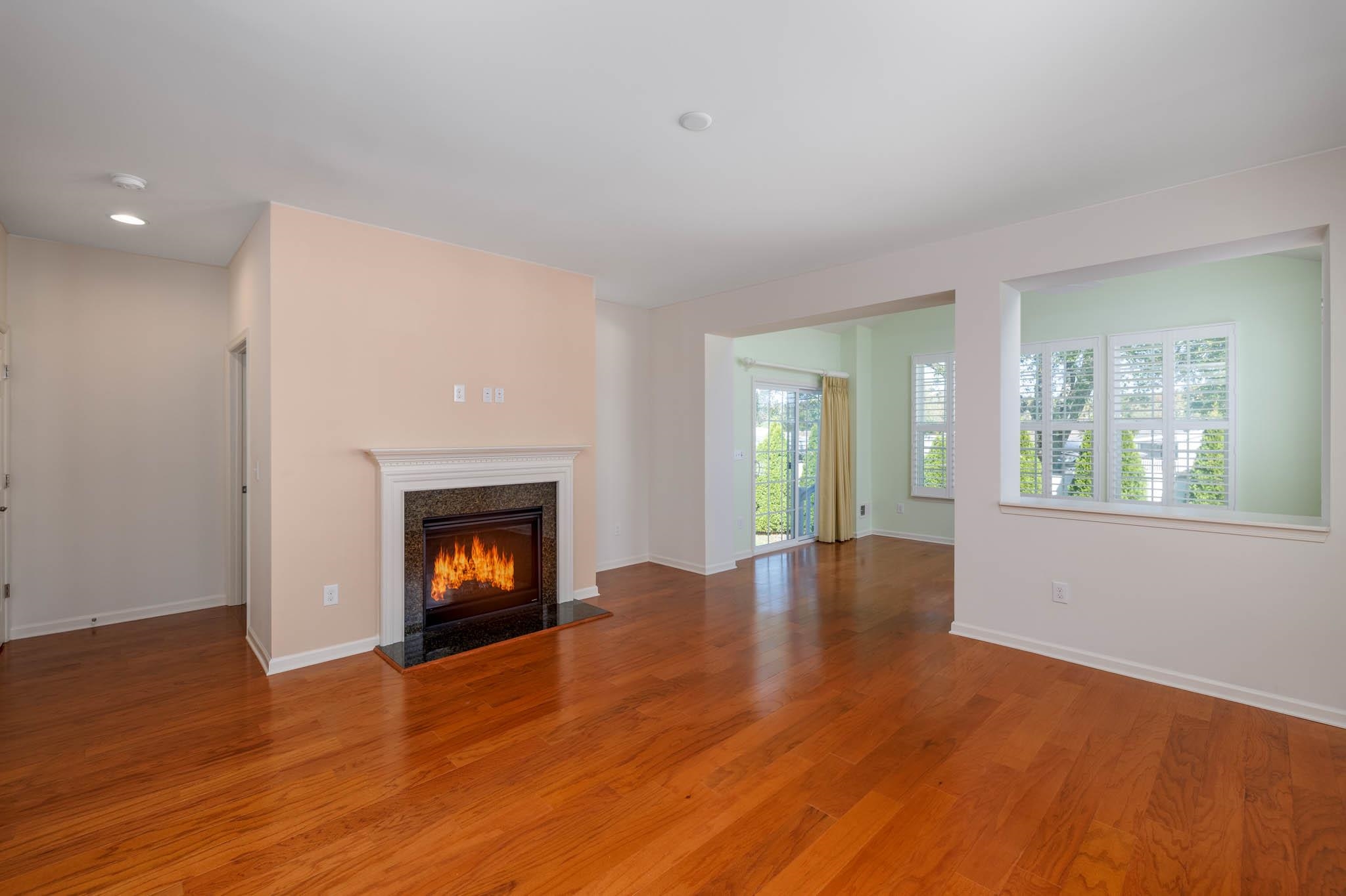 302 Aberdeen Way Rio Grande, NJ 08242 - Photo 9 of 23 a view of an empty room with window and fire place