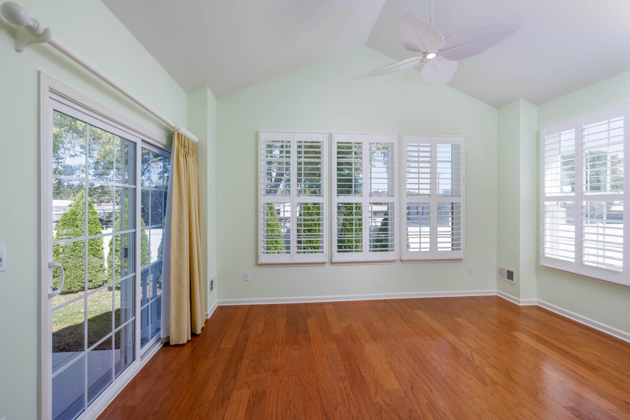302 Aberdeen Way Rio Grande, NJ 08242 - Photo 10 of 23 a view of an empty room with a window and wooden floor