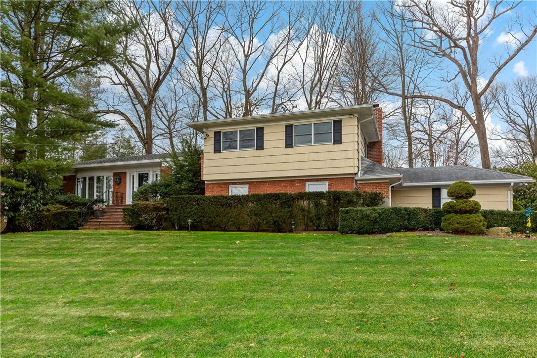 4 Magnolia Road Scarsdale, NY 10583 - Photo 1 of 1 a front view of house with yard and green space