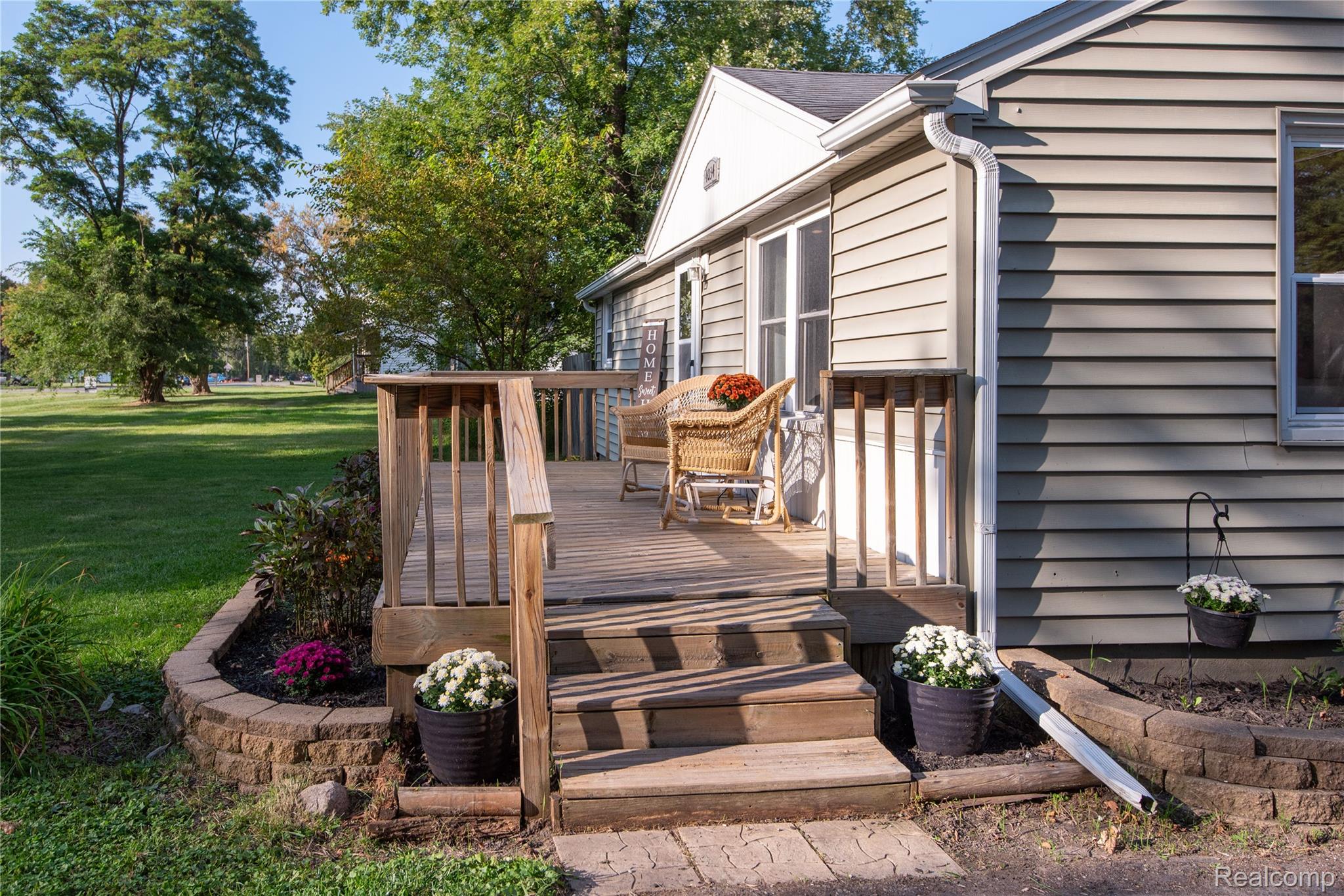 4034 Genesee Flint, MI 48506 - Photo 4 of 36 Wooden terrace with a lawn