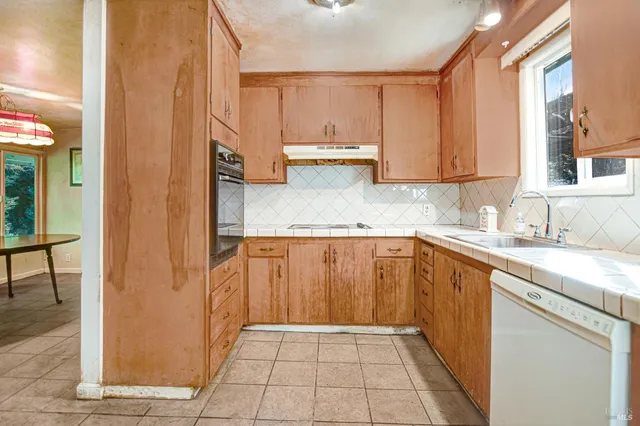 a view of a livingroom with furniture window and outside view