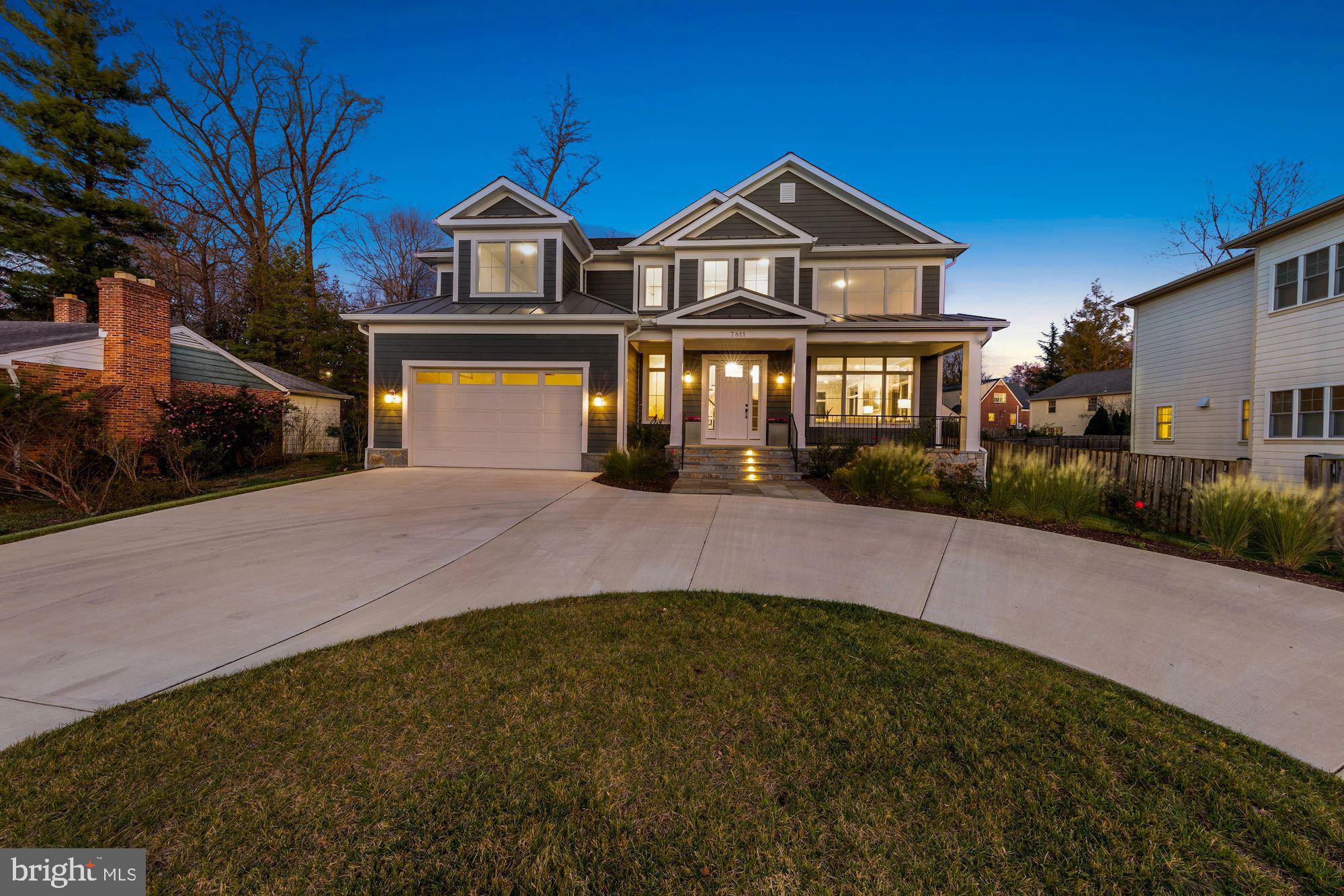7811 Aberdeen Road Bethesda, MD 20814 - Photo 16 of 18 a front view of a house with a yard and garage
