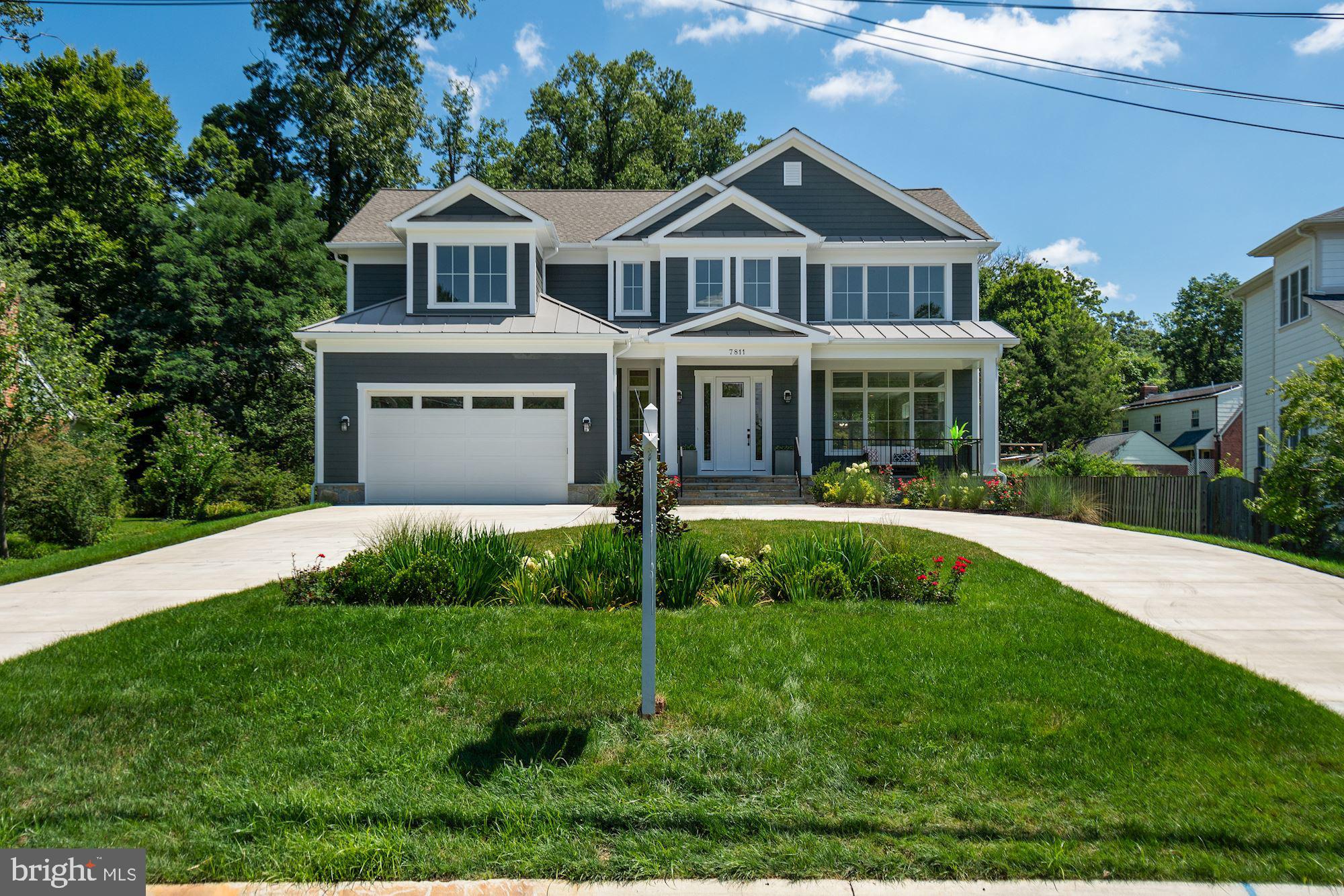7811 Aberdeen Road Bethesda, MD 20814 - Photo 4 of 18 a front view of a house with a yard
