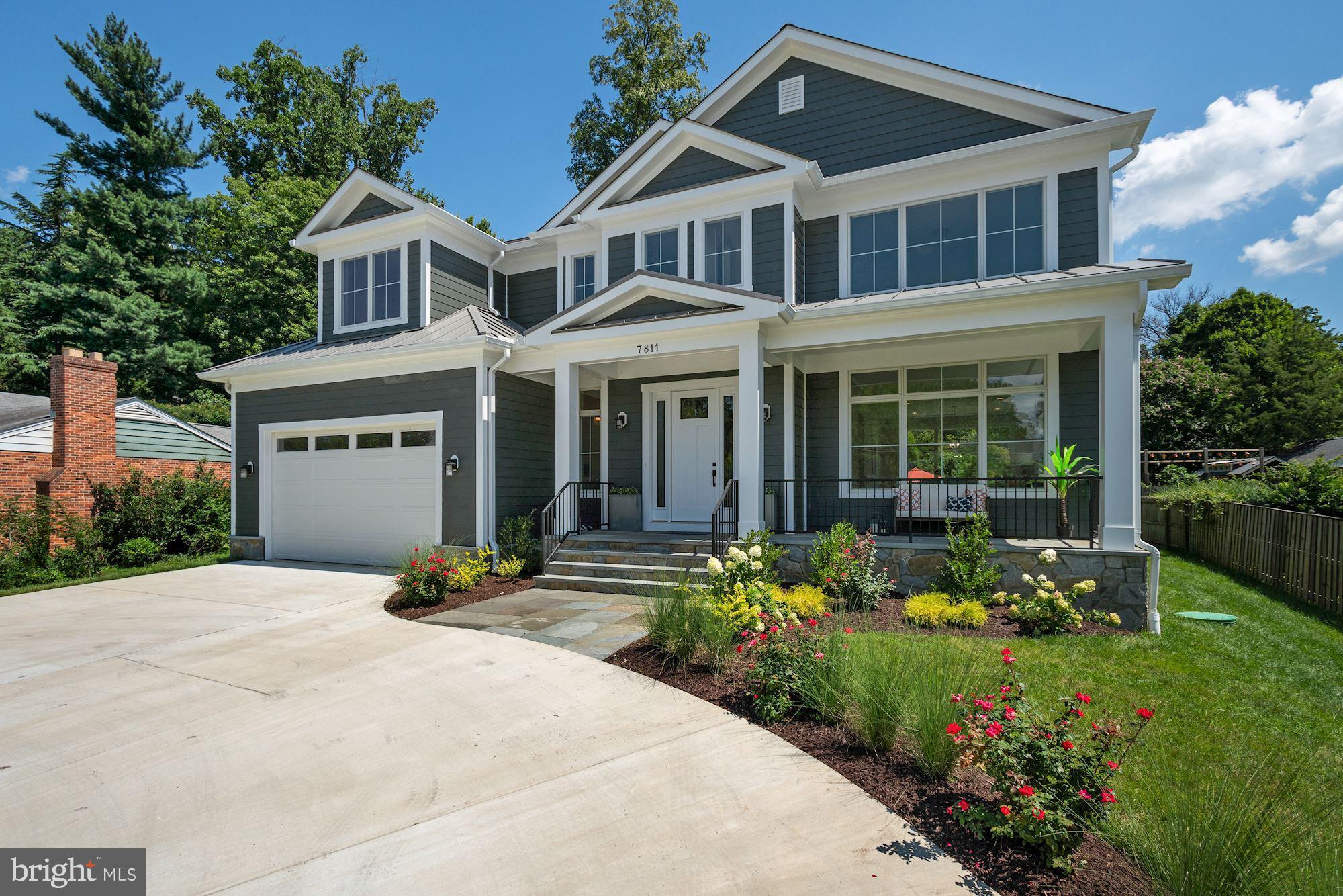 7811 Aberdeen Road Bethesda, MD 20814 - Photo 6 of 18 a front view of a house with sitting space and garden