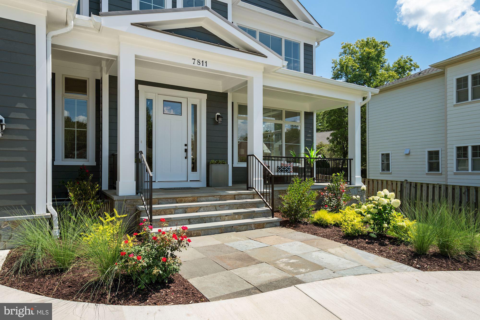 7811 Aberdeen Road Bethesda, MD 20814 - Photo 7 of 18 a front view of a house with lots of flowers
