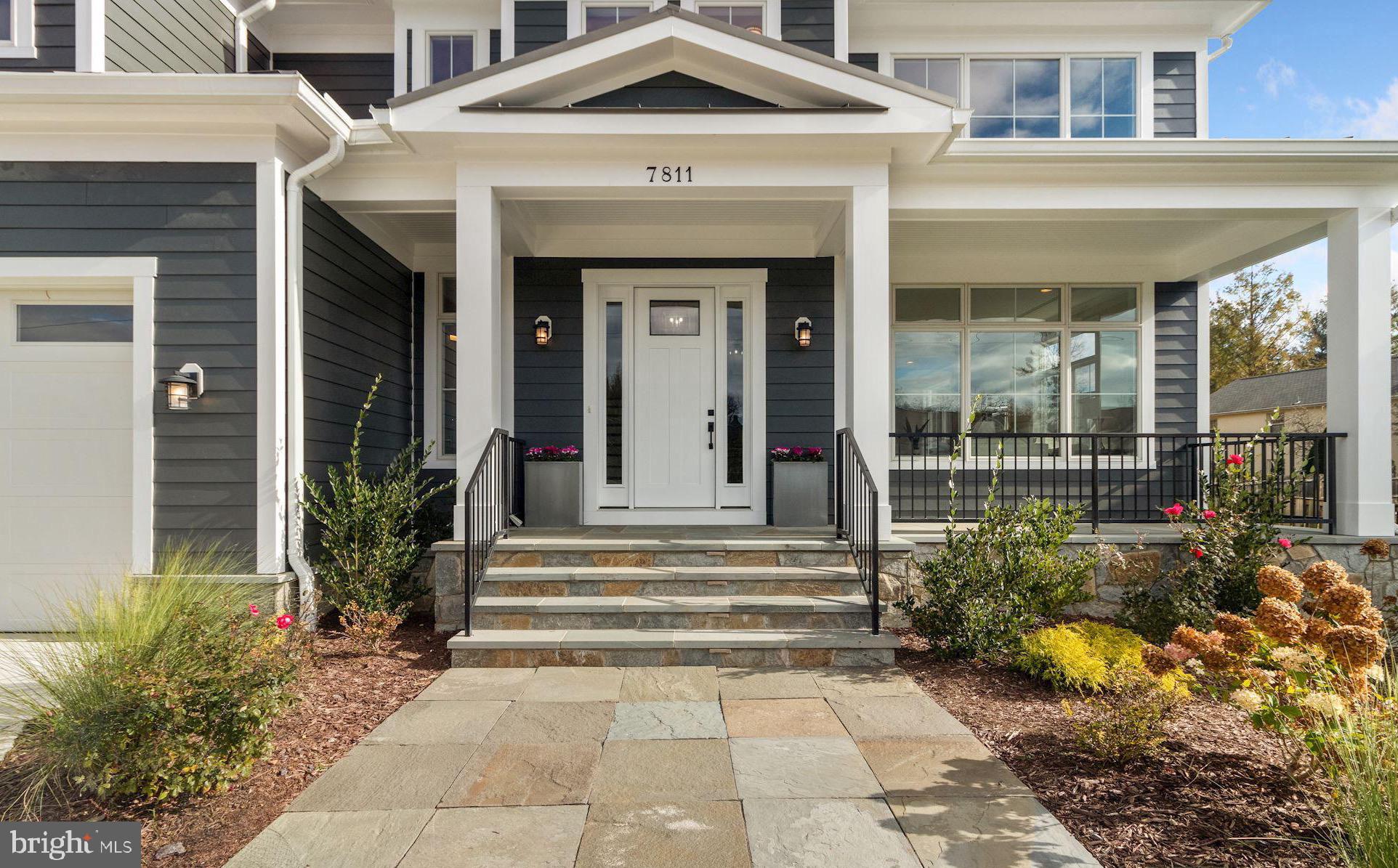 7811 Aberdeen Road Bethesda, MD 20814 - Photo 8 of 18 a front view of a house with a porch