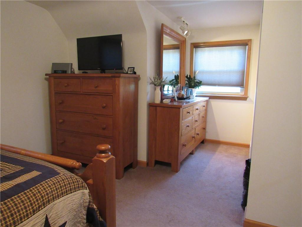 119 Eastern Drive Lower Burrell, PA 15068 - Photo 16 of 24 a bedroom with a bed and flat screen tv