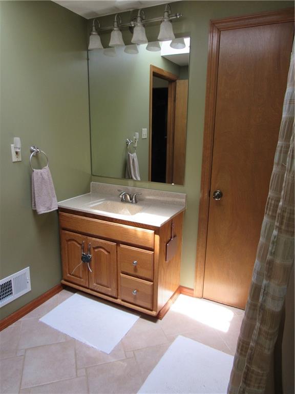 119 Eastern Drive Lower Burrell, PA 15068 - Photo 18 of 24 a bathroom with a sink and a mirror