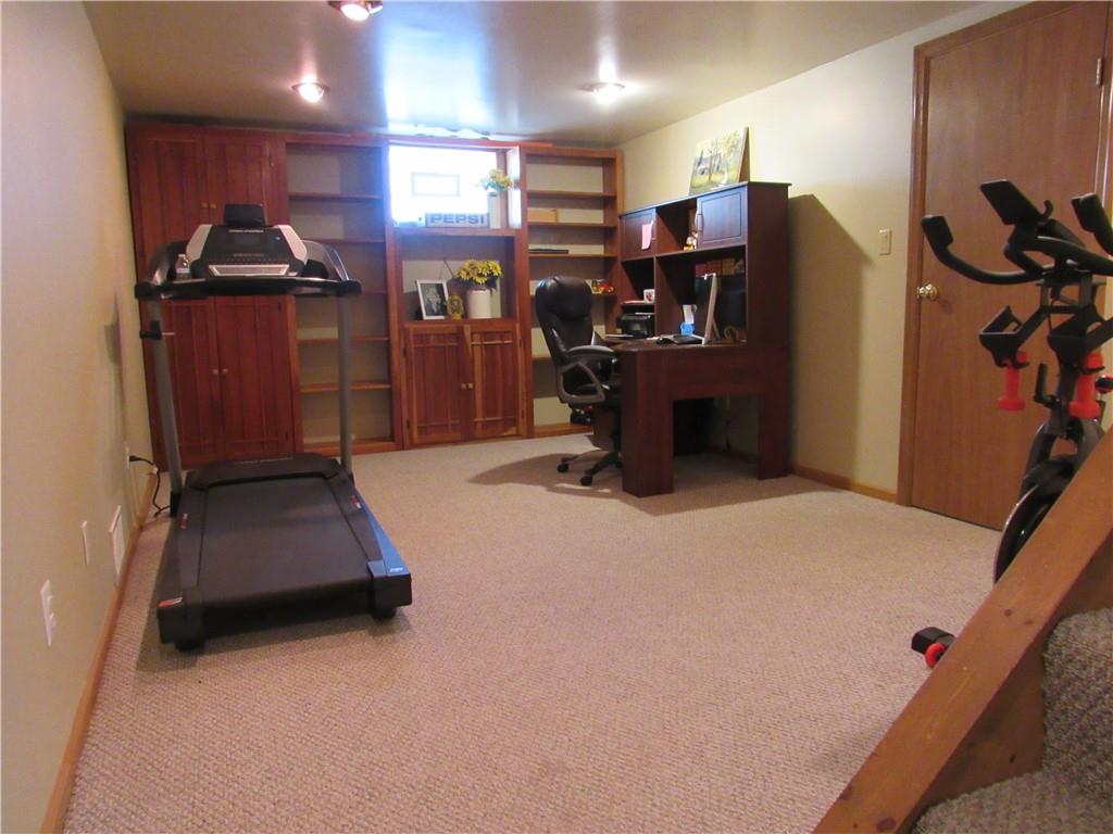 119 Eastern Drive Lower Burrell, PA 15068 - Photo 20 of 24 a room with gym equipment and a refrigerator