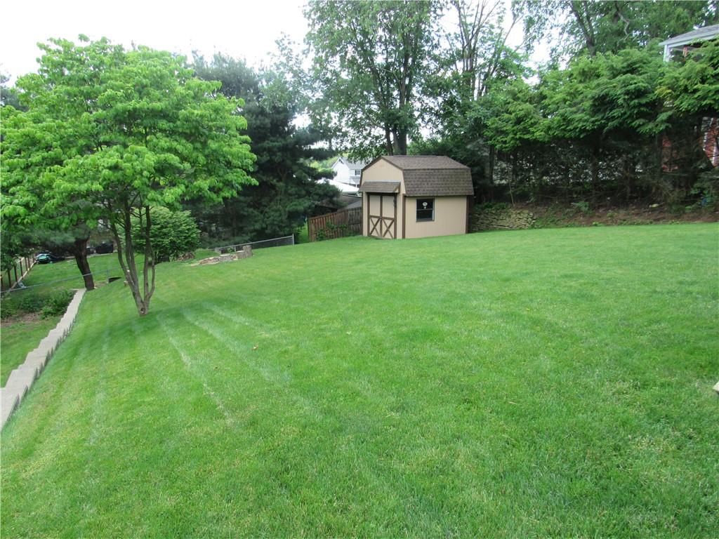 119 Eastern Drive Lower Burrell, PA 15068 - Photo 23 of 24 a view of a house with backyard and a sitting area