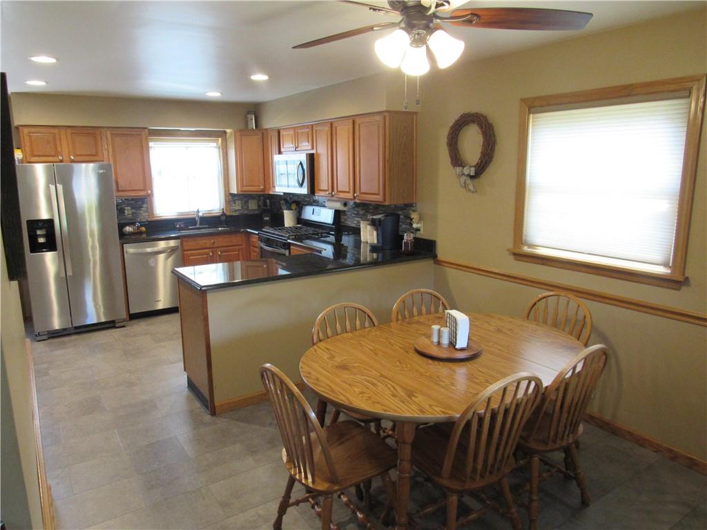 119 Eastern Drive Lower Burrell, PA 15068 - Photo 5 of 24 a view of a dining room with furniture and a chandelier