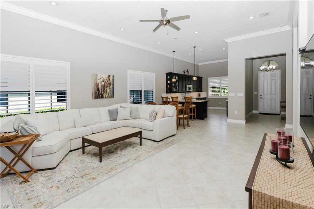 5265 Messina Street Ave Maria, FL 34142 - Photo 11 of 30 a living room with furniture and a wooden floor