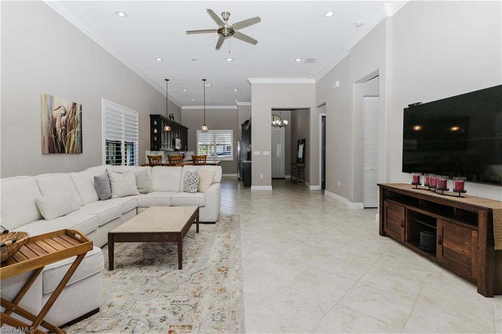 5265 Messina Street Ave Maria, FL 34142 - Photo 12 of 30 a living room with furniture and a flat screen tv