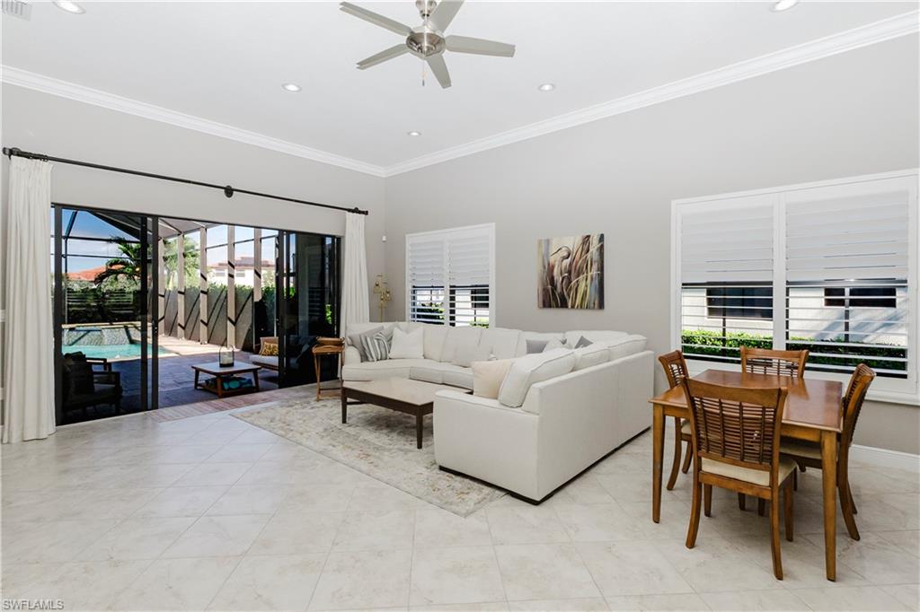 5265 Messina Street Ave Maria, FL 34142 - Photo 13 of 30 a living room with furniture and a flat screen tv