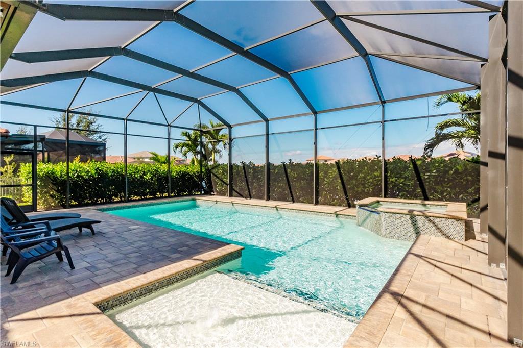 5265 Messina Street Ave Maria, FL 34142 - Photo 15 of 30 a view of a backyard with sitting area