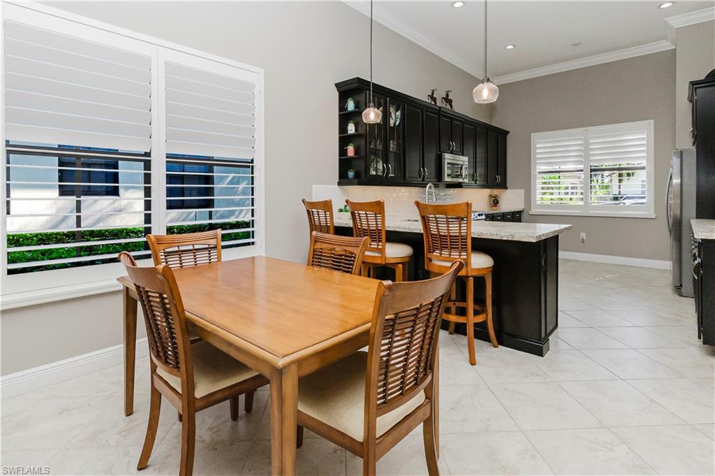 5265 Messina Street Ave Maria, FL 34142 - Photo 8 of 30 a dining room with furniture and window