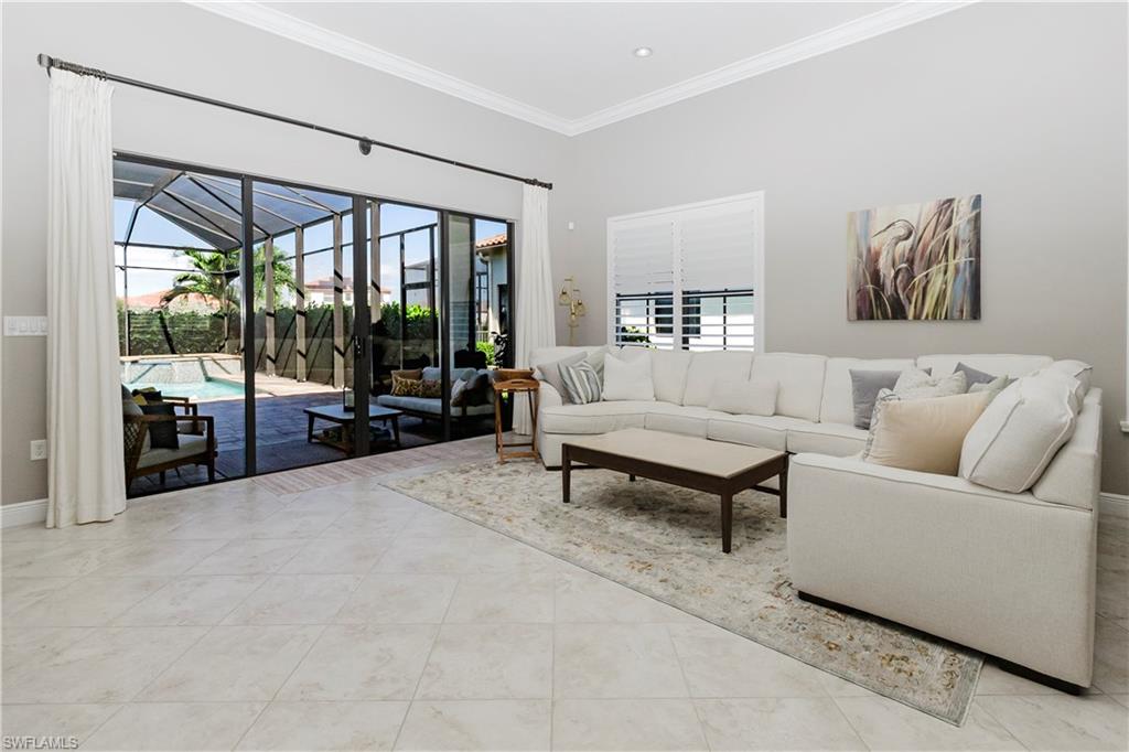 5265 Messina Street Ave Maria, FL 34142 - Photo 10 of 30 a living room with furniture and a large window