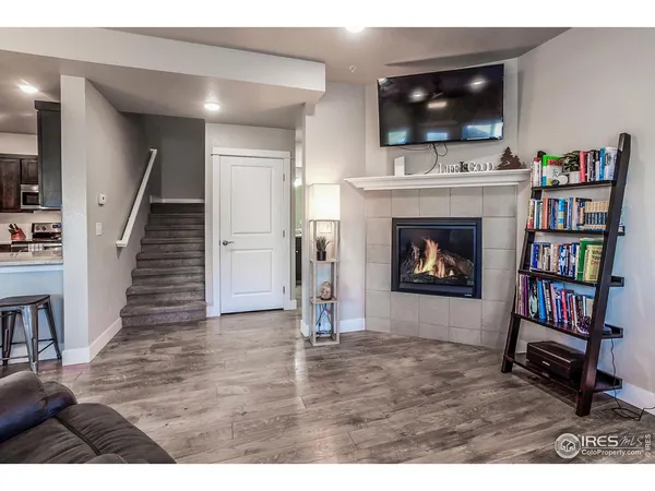 a living room with fireplace and a flat screen tv