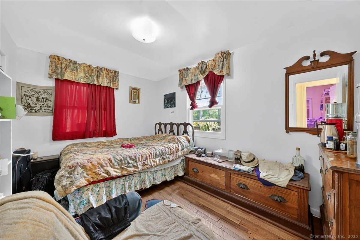 54 Mountain Road Wilton, CT 06897 - Photo 16 of 27 a bed room with a bed and a dresser