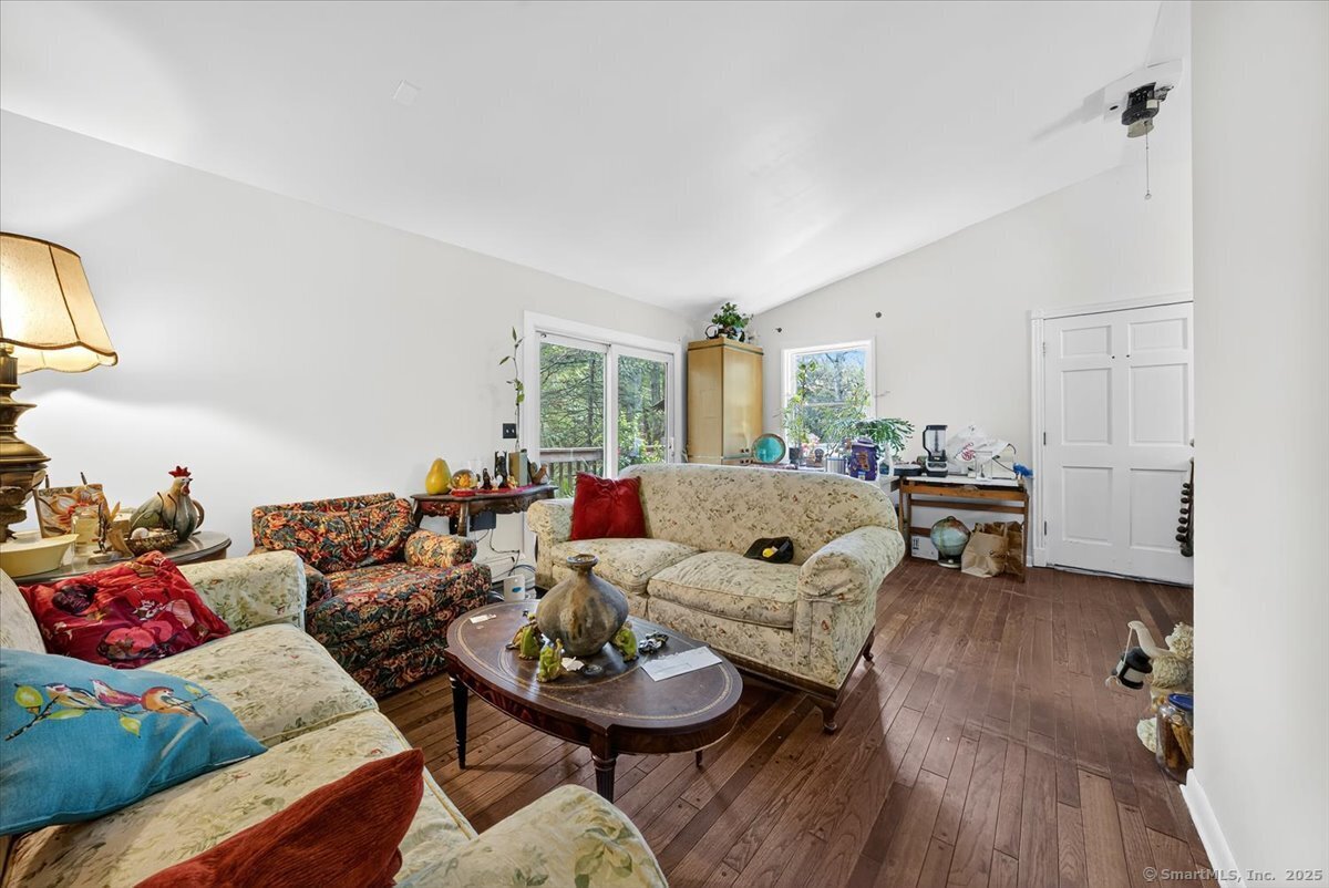 54 Mountain Road Wilton, CT 06897 - Photo 18 of 27 a living room with furniture and a wooden floor