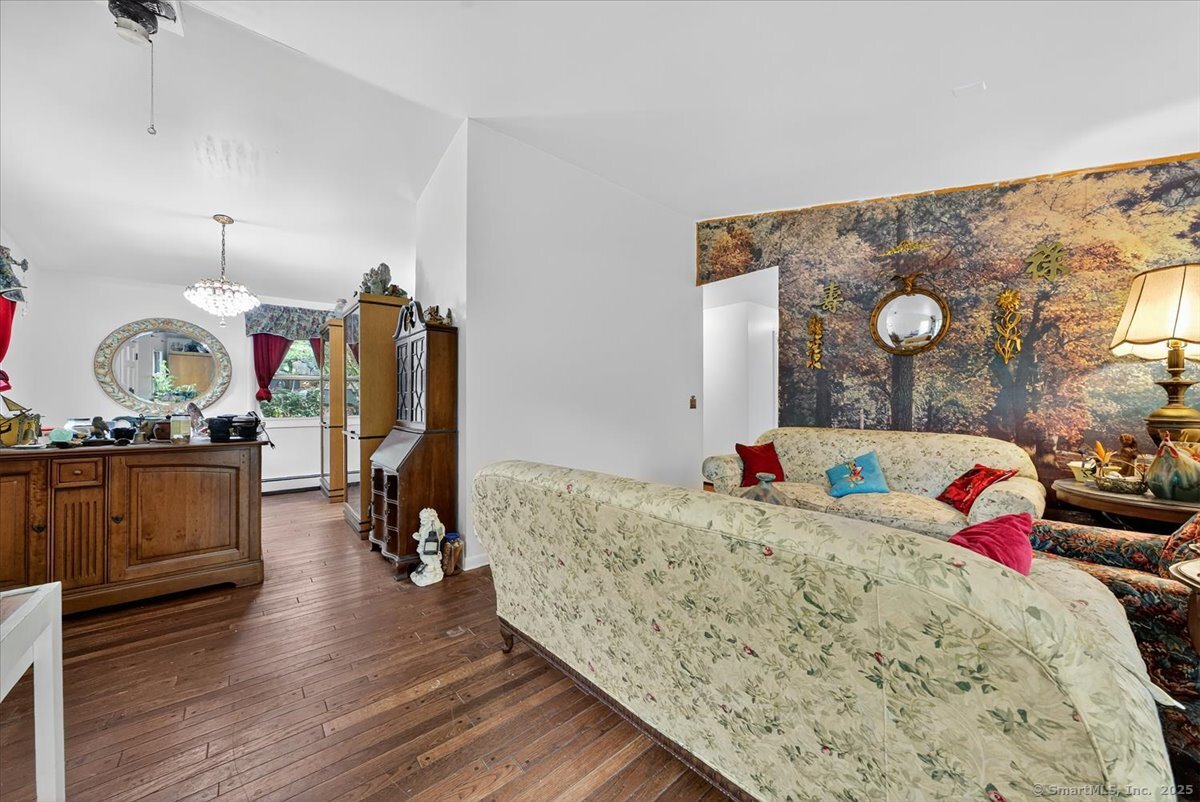 54 Mountain Road Wilton, CT 06897 - Photo 19 of 27 a living room with furniture and wooden floor