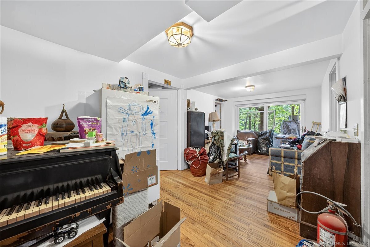 54 Mountain Road Wilton, CT 06897 - Photo 21 of 27 a living room with furniture a rug and gym equipment