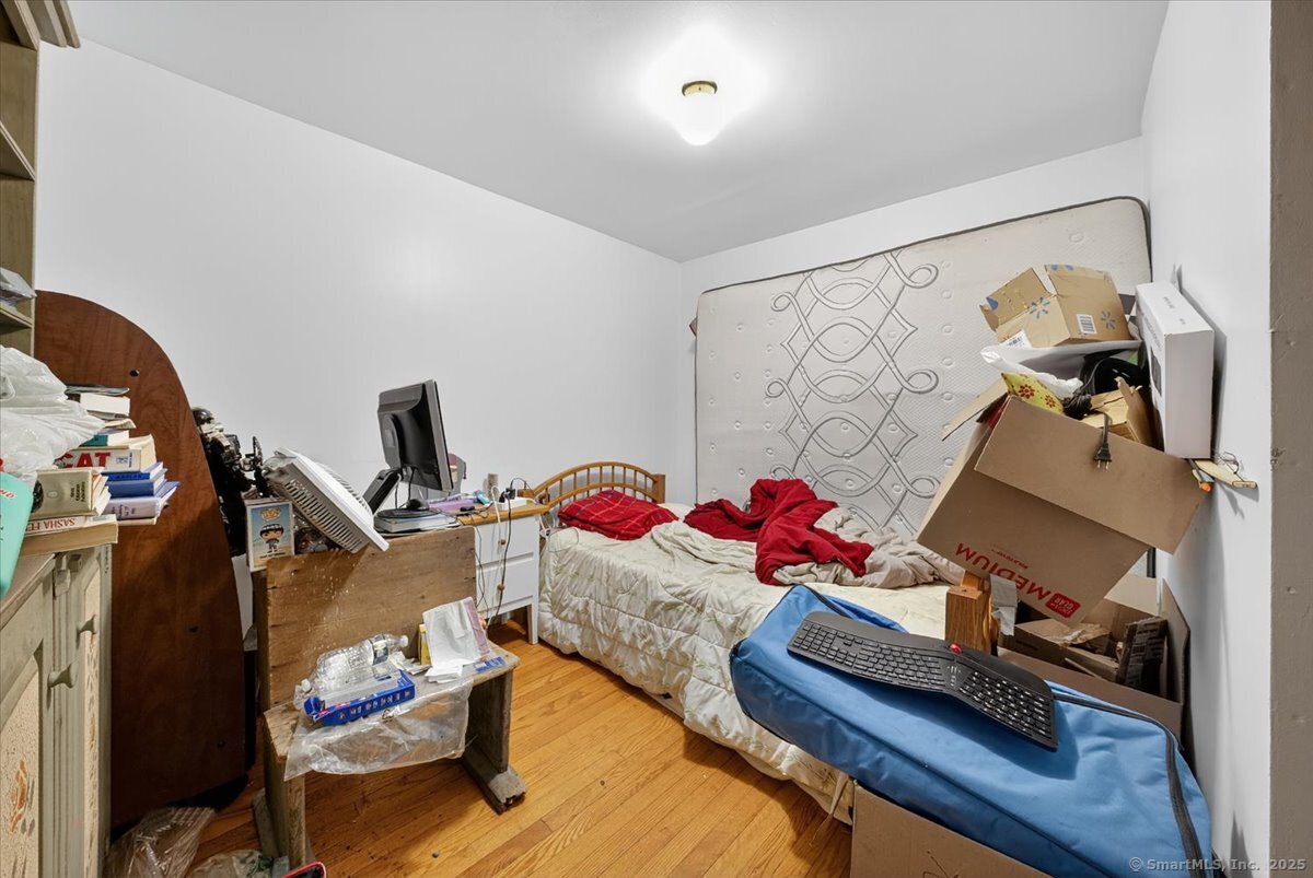 54 Mountain Road Wilton, CT 06897 - Photo 23 of 27 a living room with furniture and a flat screen tv