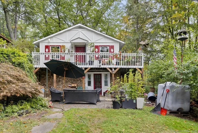 a front view of a house with a garden and porch