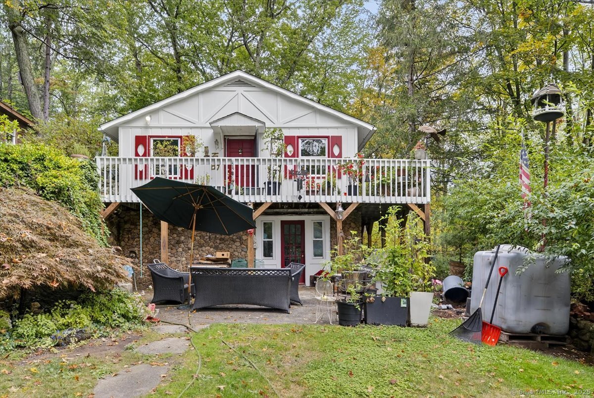 54 Mountain Road Wilton, CT 06897 - Photo 24 of 27 a front view of house with an outdoor seating