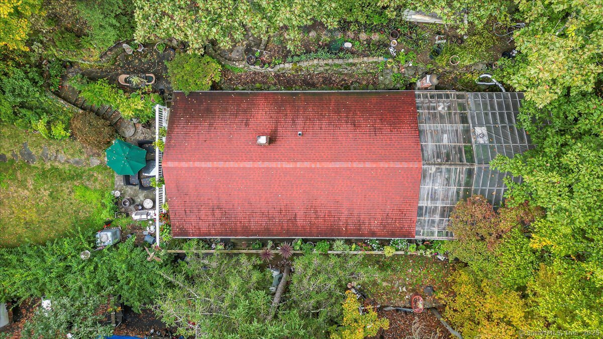 54 Mountain Road Wilton, CT 06897 - Photo 5 of 27 an aerial view of a house with a yard and large trees