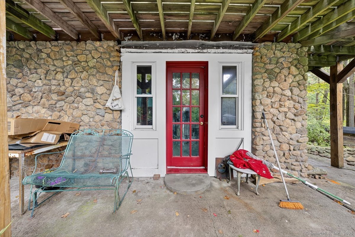 54 Mountain Road Wilton, CT 06897 - Photo 10 of 27 a view of a chairs in front of building
