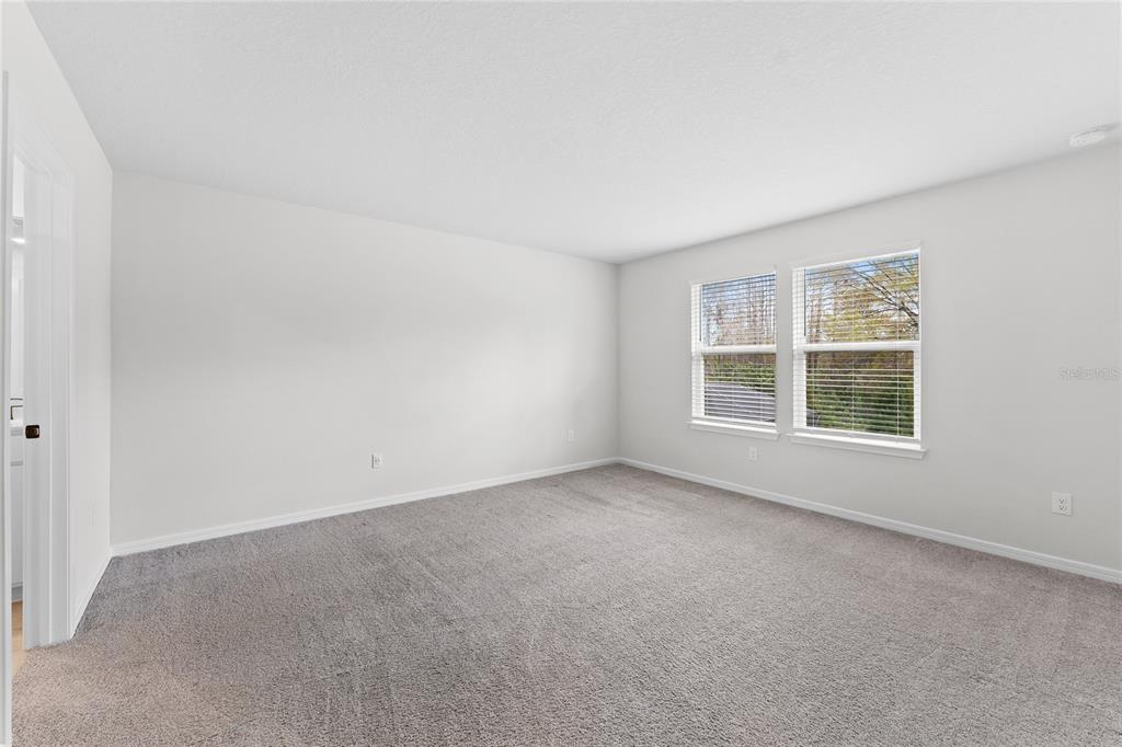 20602 Monza Loop Land O Lakes, FL 34638 - Photo 15 of 44 a view of an empty room with a window