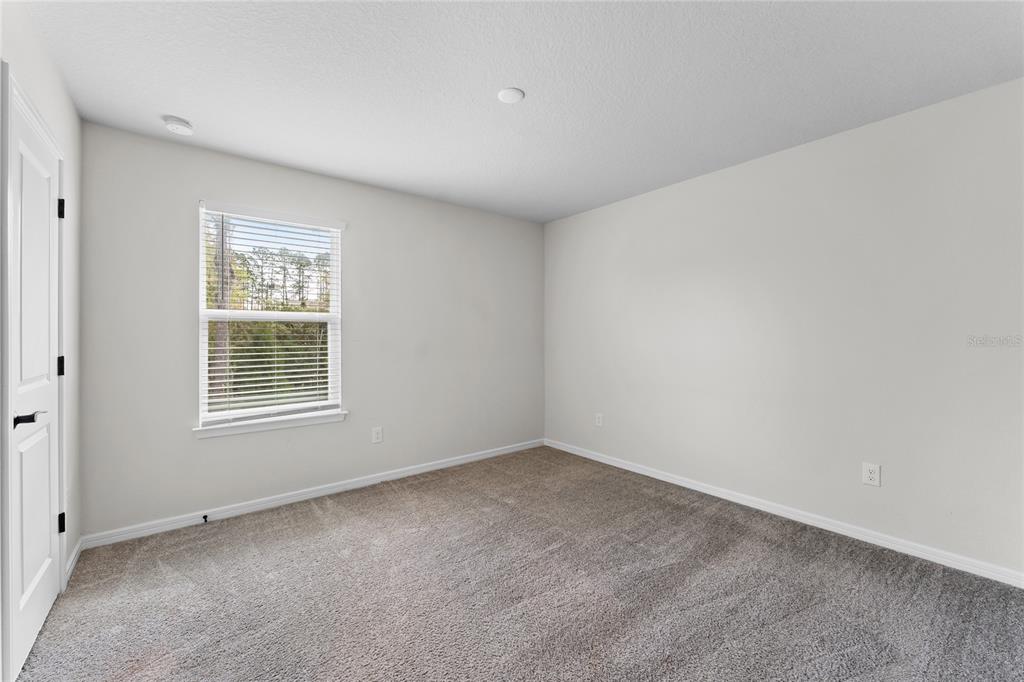 20602 Monza Loop Land O Lakes, FL 34638 - Photo 22 of 44 a view of an empty room with a window