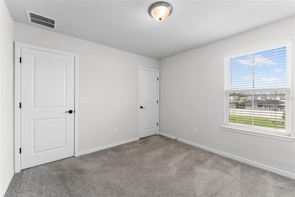20602 Monza Loop Land O Lakes, FL 34638 - Photo 28 of 44 an empty room with windows