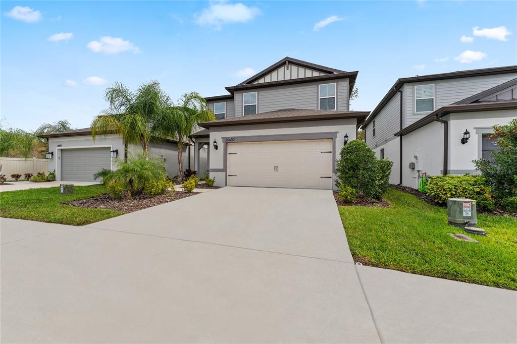 20602 Monza Loop Land O Lakes, FL 34638 - Photo 3 of 44 a front view of house with yard