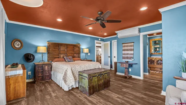 a bed room with a bed and a chandelier