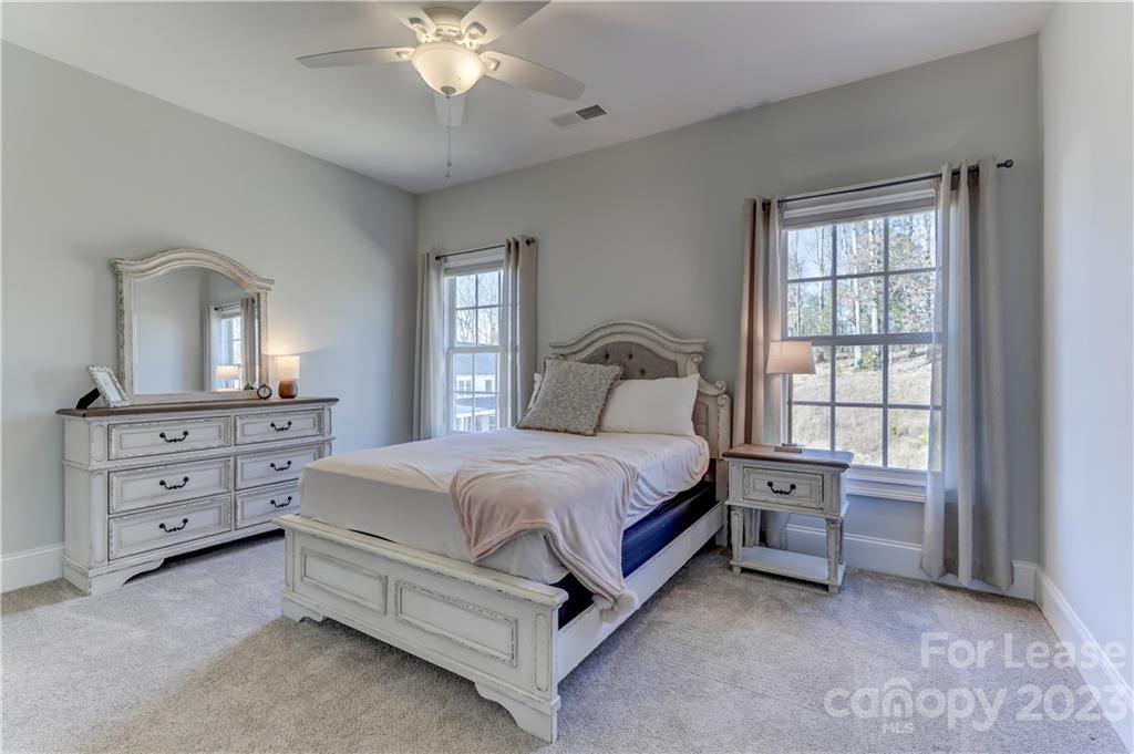 570 Crawfish Drive Fort Mill, SC 29708 - Photo 36 of 48 a bedroom with a bed and a dresser