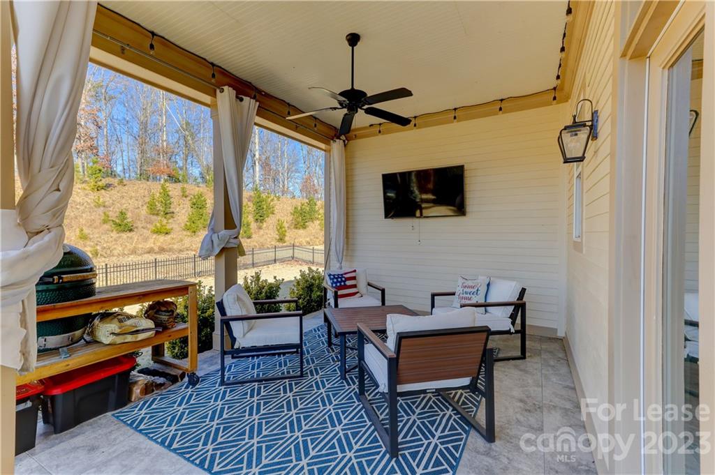 570 Crawfish Drive Fort Mill, SC 29708 - Photo 40 of 48 a living room with furniture a flat screen tv and a window