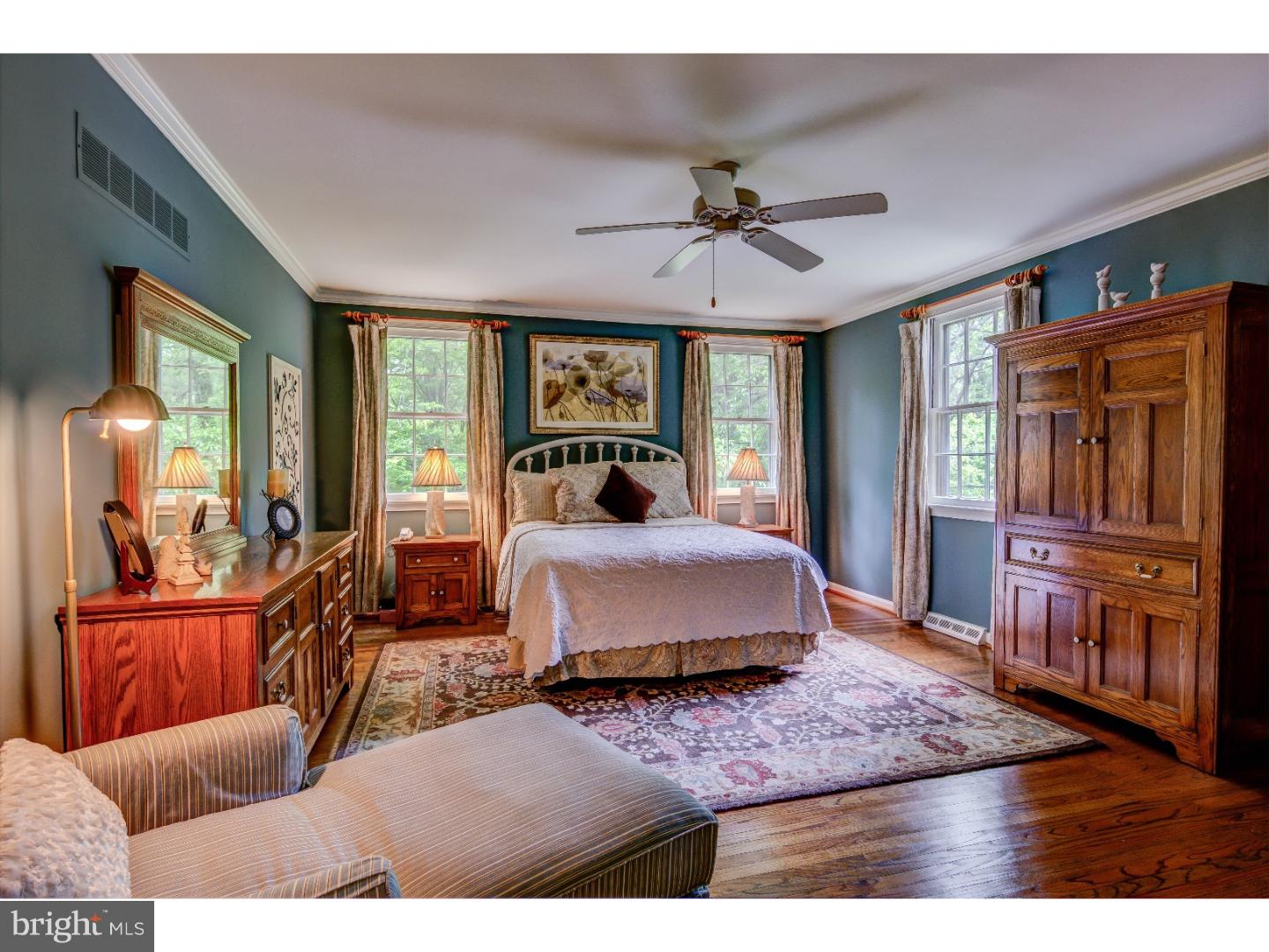 640 Malin Road Newtown Square, PA 19073 - Photo 14 of 24 a bedroom with a large bed a chandelier and dresser