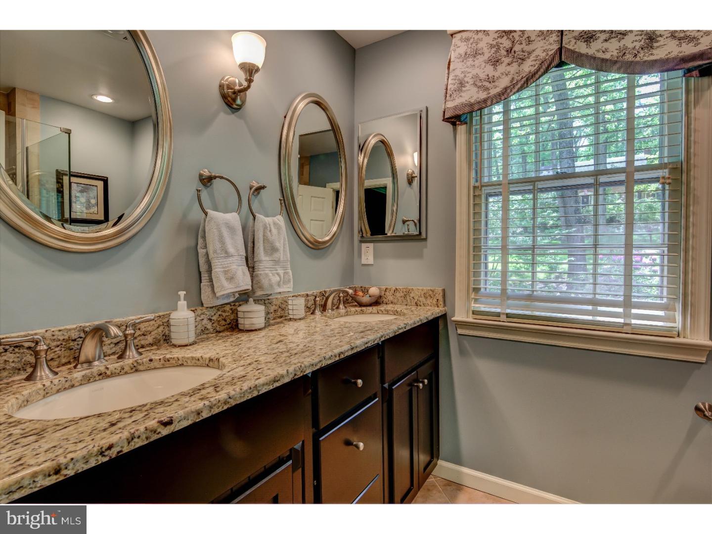 640 Malin Road Newtown Square, PA 19073 - Photo 15 of 24 a bathroom with a granite countertop sink and a mirror