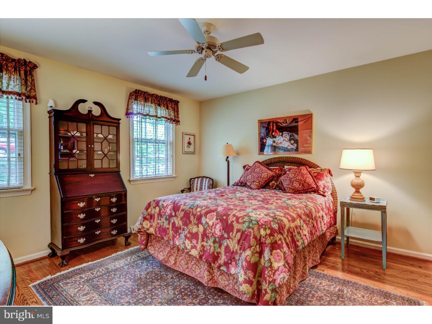 640 Malin Road Newtown Square, PA 19073 - Photo 17 of 24 a bedroom with a bed and a table in it