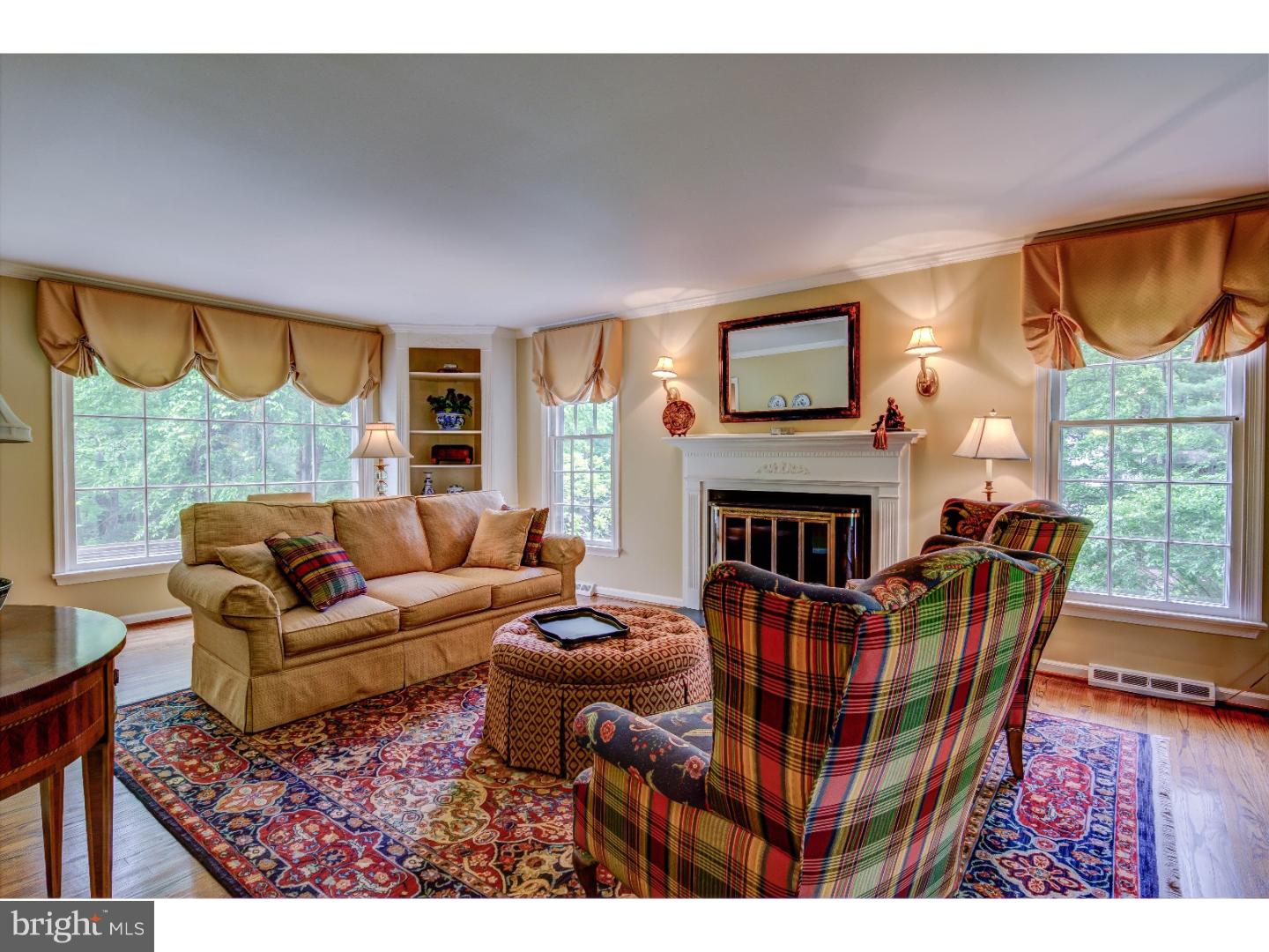 640 Malin Road Newtown Square, PA 19073 - Photo 5 of 24 a living room with furniture a fireplace and a large window