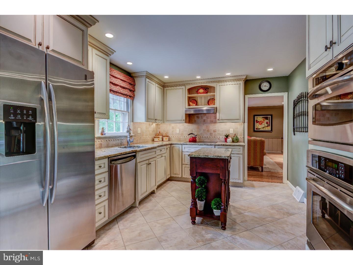 640 Malin Road Newtown Square, PA 19073 - Photo 9 of 24 a kitchen with stainless steel appliances granite countertop a refrigerator and a stove