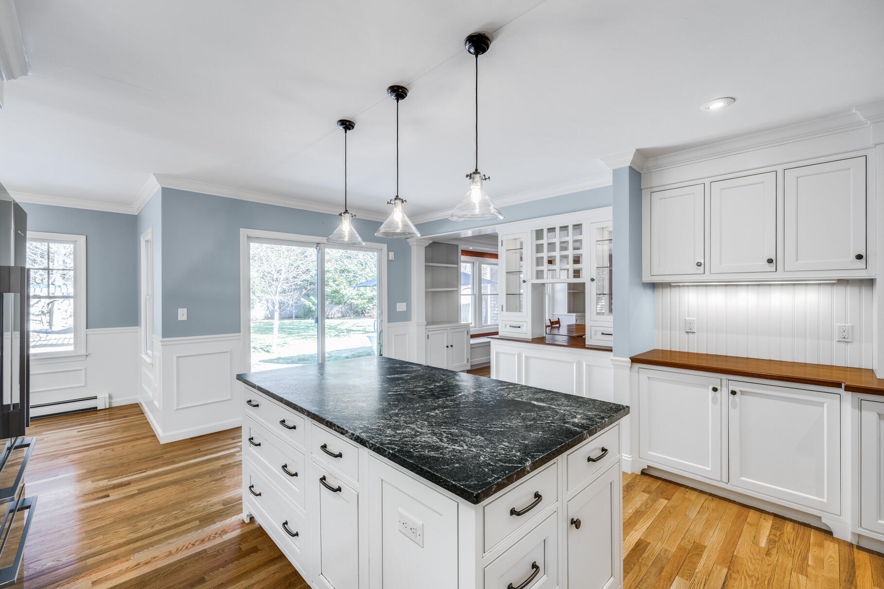 25 Blanid Road Osterville, MA 02655 - Photo 11 of 27 a kitchen with kitchen island granite countertop a sink a counter space appliances and cabinets