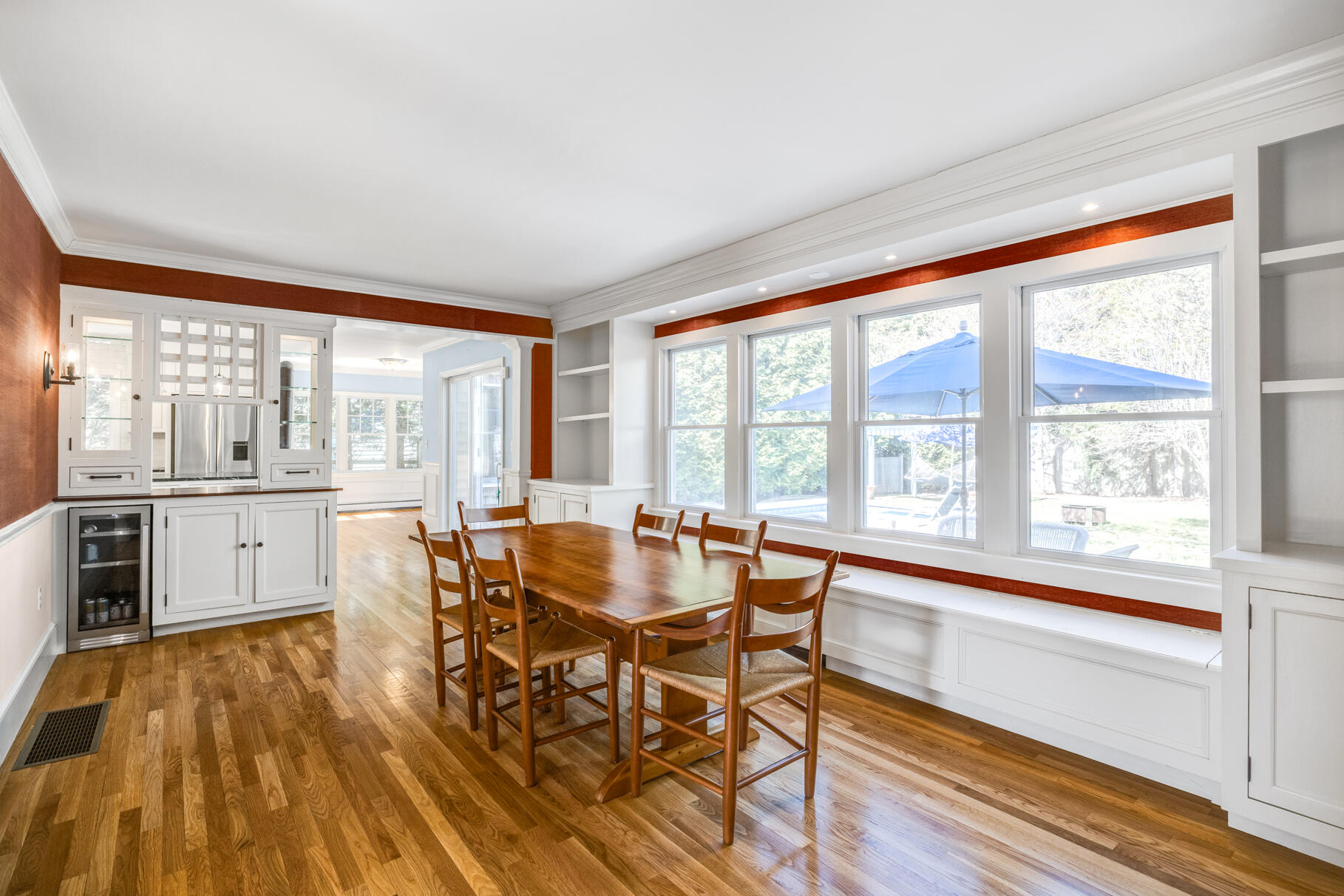 25 Blanid Road Osterville, MA 02655 - Photo 13 of 27 a dining room with wooden floor and a floor to ceiling window